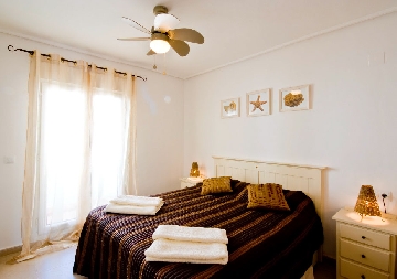 Luxury main bedroom, access to balcony